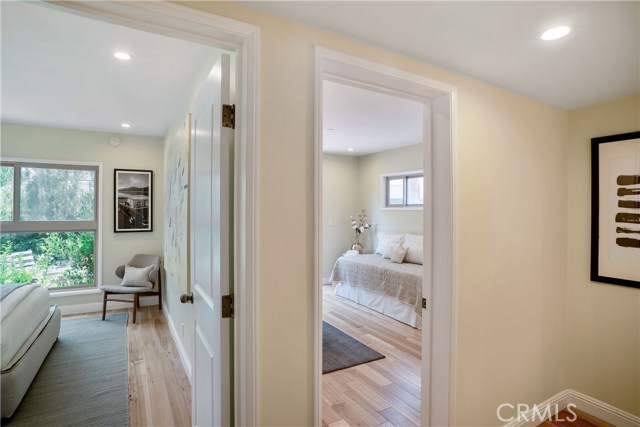 These downstairs bedrooms are filled with light with the wide plank hardwood flooring thoughout, new recessed lighting, closets and fresh custom paint throughout. When you wake up to the lush landscape of greenery and a giving tree that reaches up and out into the sky, you are reminded that you are living in the tree section of Manhattan Beach.