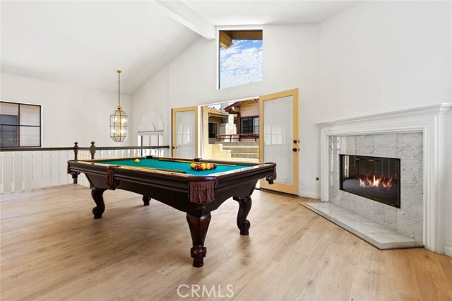 Living room with fireplace and balcony