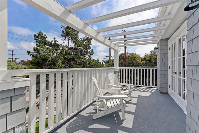 Outdoor deck off upstairs guest bedrooms.