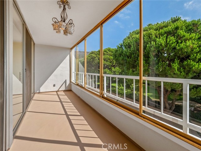 Balcony off bedrooms overlooking greenspace, pool and ocean beyond