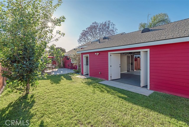 More expansive yard space.  Go through the door to the back house laundry or the double doors to the two car garage.