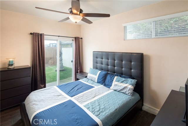 The master bedroom is a spacious rooms with wonderful views of the backyard and sparkling pool.