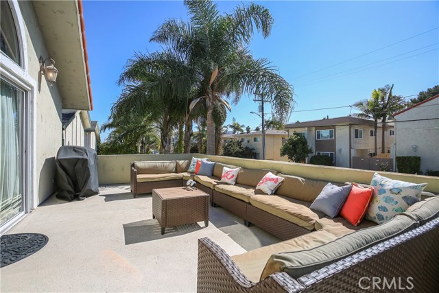 Oversized Upper Level Deck offers South Facing exposure to warm sun & cool breezes.  It's elevation & solid walls offer privacy from the quiet, one-way street below.