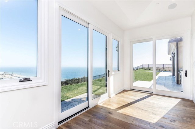 Siding doors in master bedroom open to back yard and side yard areas