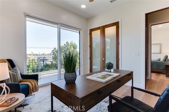 2nd bedroom with walk-in closet & patio with city view