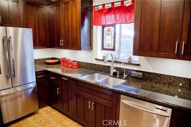 Remodeled Kitchen with granite counters and stainless steel appliances.