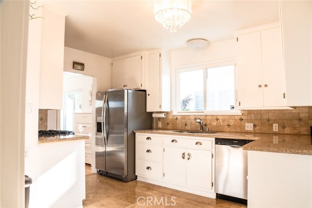 Kitchen opens to the dining room as well as the living room!