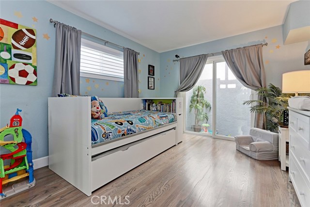 Guest bedroom with access to outdoor atrium area.