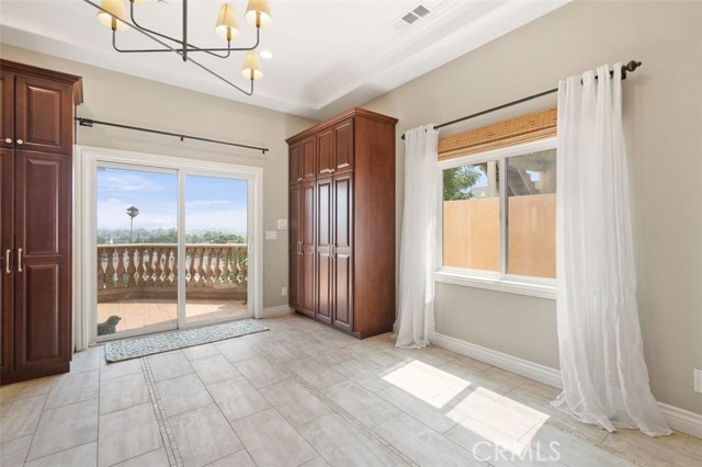 Built in pantry cabinets in kitchen dining area leading to the first floor deck.