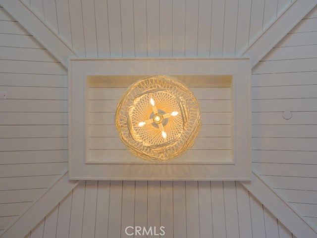 MBR Vaulted Ceiling with Custom Tongue in Groove Wood Feature.