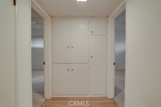 Small hallway area leading to the two additional bedrooms.