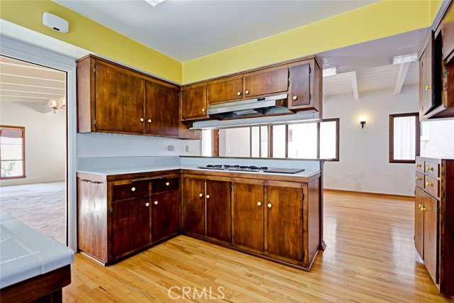 Looking from kitchen into dining and living room areas while the family room off kitchen is to the east side of the home.