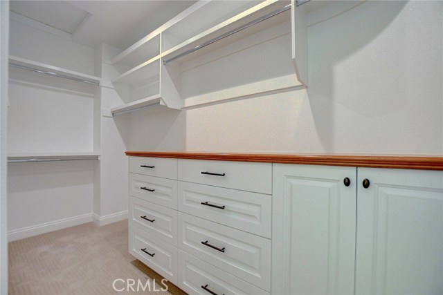 2nd Level . . . Master walk in closet with custom cabinetry