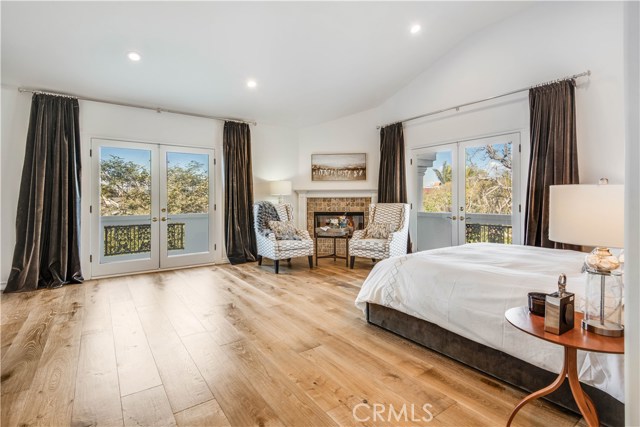 The master bedroom also includes a cozy fireplace