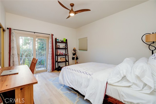 Bedroom #3 with walk-in closet and sliding doors to the backyard