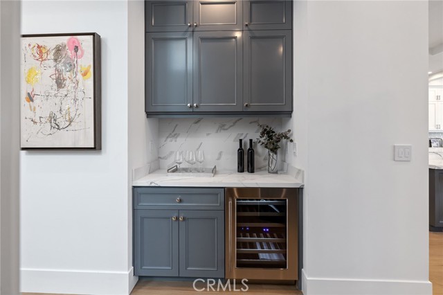 Well appointined service bar with wine storage