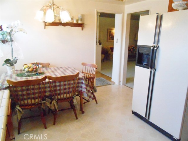 Kitchen Eating Area Partially Open to Formal Dining Room and Living Room. Or Close the Hidden Pocket Doors and Make it Private for Surprise Meal Prepping.