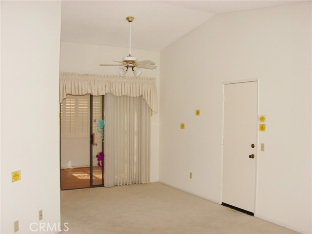 SAME VIEW OF FORMAL DINING ROOM WITHOUT FURNISHINGS. IN THE BACKGROUND IS THE DEN/HOME OFFICE ROOM.