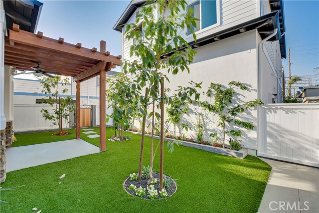 BACKYARD COVERED PATIO WITH OVERHEAD FAN