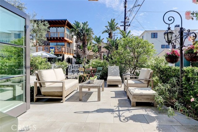 View of front patio and gardens from 1st floor beach room
