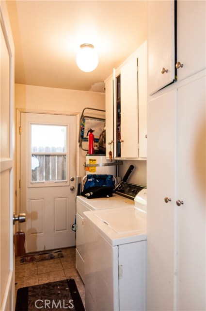 Unit #2 also has its own laundry room with washer/dryer and door to side.