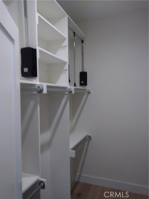 LARGE WALK-IN CLOSET WITH DUEL PULL-DOWNS RODS THIS ALMOST DOUBLES YOUR CLOSET SIZE