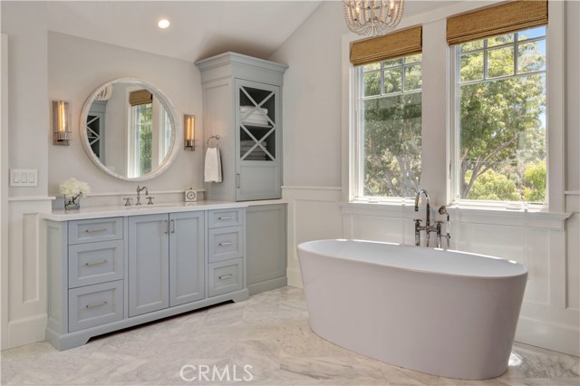 Showcase master bathroom w/ garden tub, dual vanities + walk-in shower