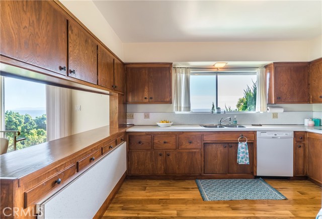 Spacious kitchen with drop leaf breakfast table.  Kitchen cabinets have pull-outs for pots and pans.