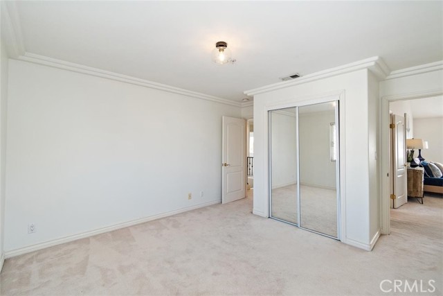 Adjoining bedroom with hall and primary bedroom access