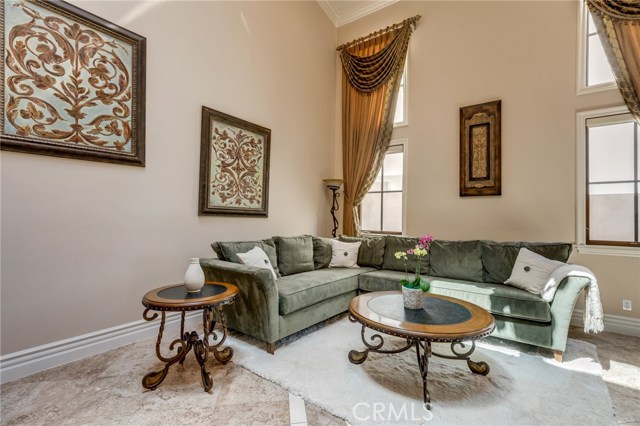 Formal Living Room with high ceilings and skylight