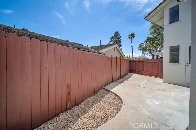 Private enclosed yard with access to the utility room containing the washer/dryer