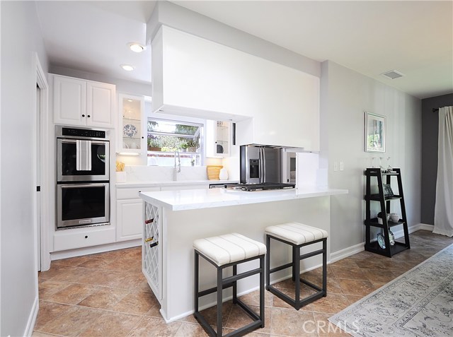 The kitchen just underwent a significant remodel where counter tops were replaced, new appliances were installed and an updated color brought a fresh new look to this meticulous home.