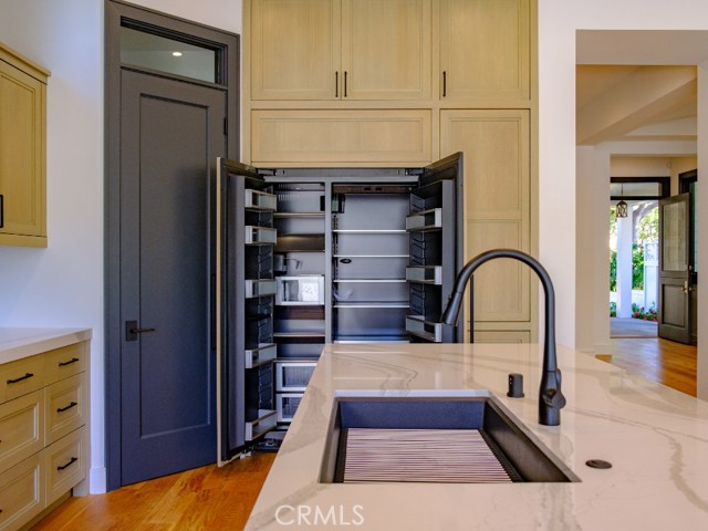 The Kitchen Island measures 10.5' x 3.5' is full granite with Waterfall sides.