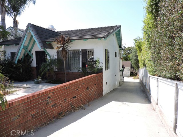 Long Driveway leads to 5 single car garages.  Plenty of parking!