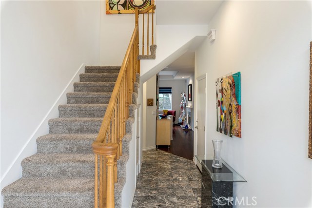 Formal Entry Leads to Living Areas (on main level) & Upstairs to Bedrooms
