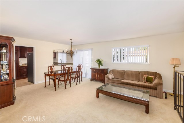 Very bright dining and living area by kitchen.