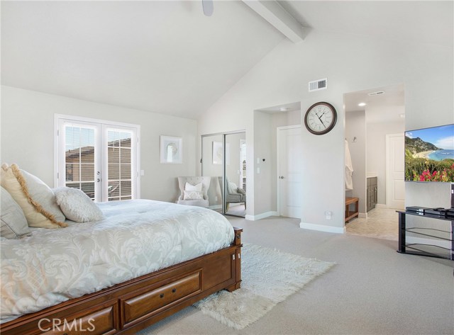 Master Bedroom with french doors leading out to an upstairs patio