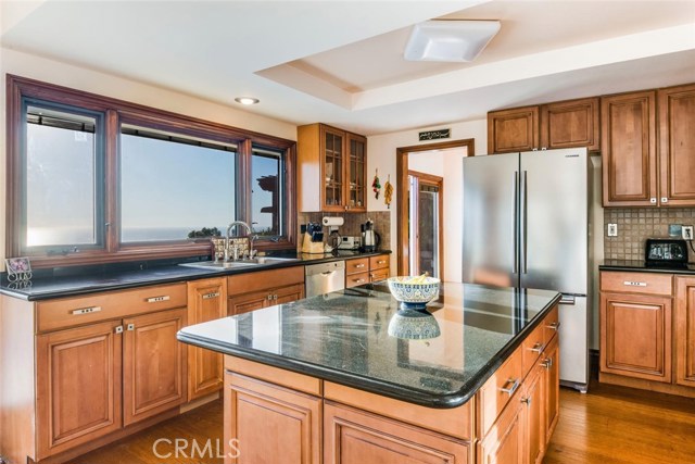 The kitchen is central and convenient with a wide open view.