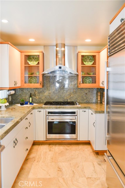 Custom cabinets, granite countertops, sub-zero refrigerator.