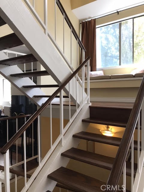 Stairway up to the landing for reading in sunlit comfort