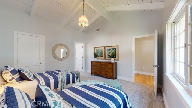 Another view of the upstairs bedroom suite and entrance to the ensuite bathroom. the washer/dryer room is on this floor making it easy for the laundry chores.