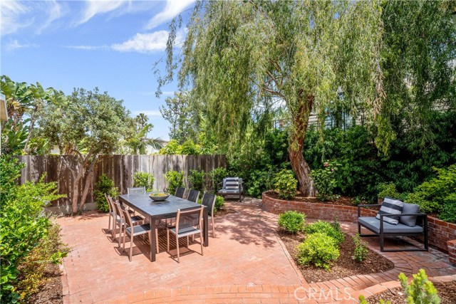 Yes, a beautiful backyard with lush green foliage and that beautiful tree. Privacy and serenity. We call it the tree section for a reason. Completely remodeled interior, new windows, paint, updates galore. Blocks to downtown Manhattan Beach shops, restaurants, our ocean view library and more. The famous Strand, surfing, sherbert colored sunsets, top rated schools and casual beach living at its finest. Time for relaxation and a life of ease awaits you in this newly remodeled home with a patch of patio perfe