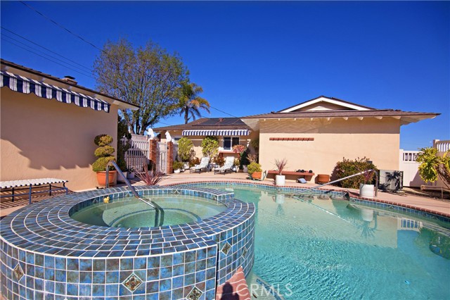 Pool. Spa area wotj twp awnings surrounded by Vinyl Fence