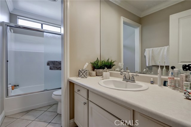 Within the one bedroom one bath unit downstairs is this hall bathroom with shower and tub.