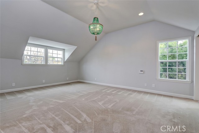 Charming master bedroom with dormer and walk-in closet.