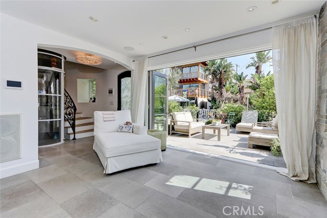 1st floor beach room, folding Marvin doors, pneumatic vacuum elevator in background