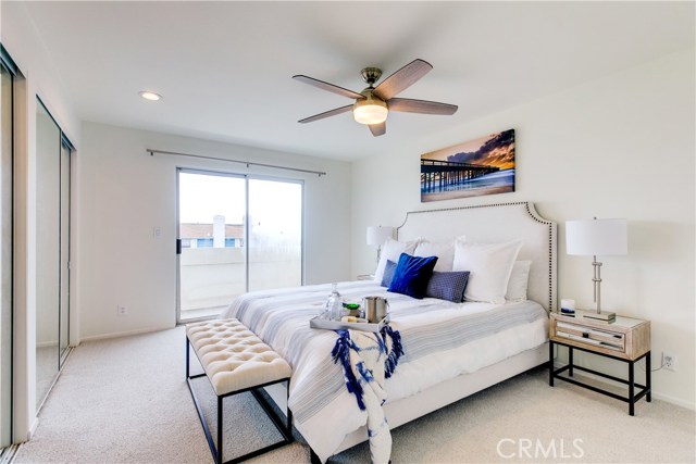 The north bedroom is the master bedroom and includes new carpet, new sliding glass door and access to the balcony. There is a large mirrored closet and an en-suite master bathroom.