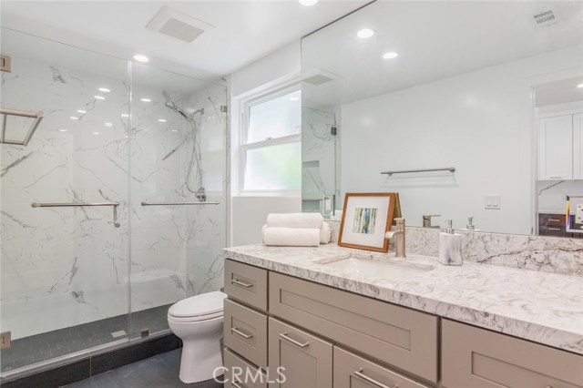 This luxurious bathroom services the upper level of the home.