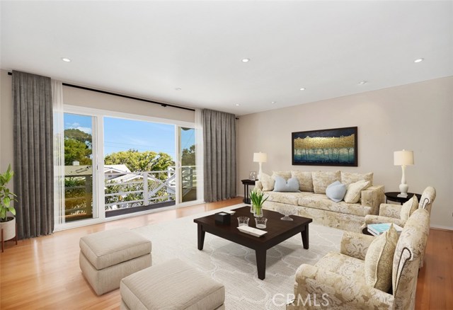 Spacious living room with open plan into generous dining room and out to the large view deck.