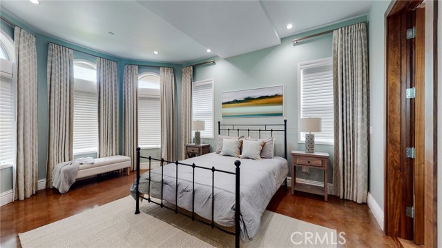 Main Floor Master Bedroom with custom Shades and Blackout Curtains. Very Cozy!